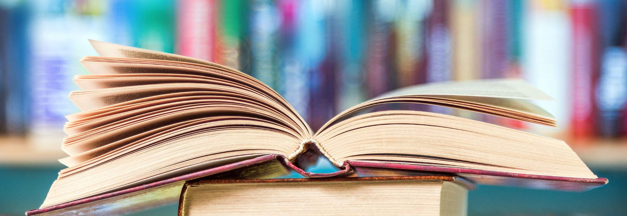 open book on table in library